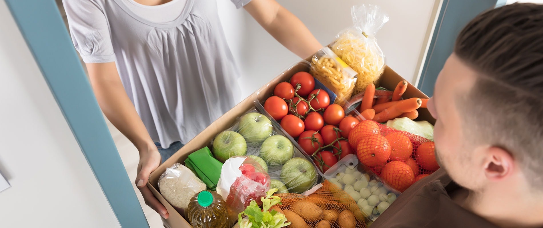 Умная доставка. A Box with food in supermarket. Grocery delivery.